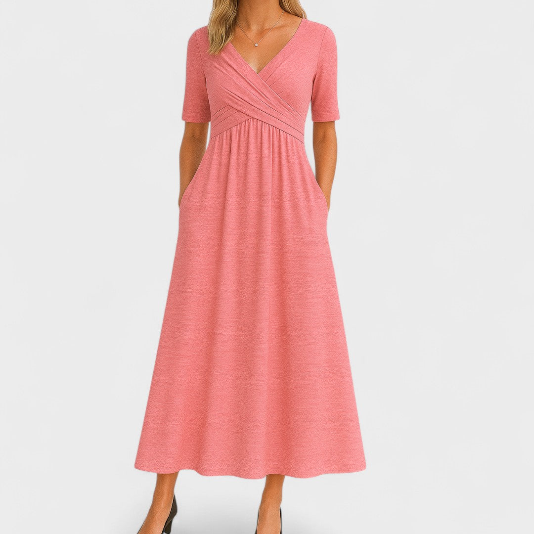 Pink dress with a V-neck and short sleeves on a white background
