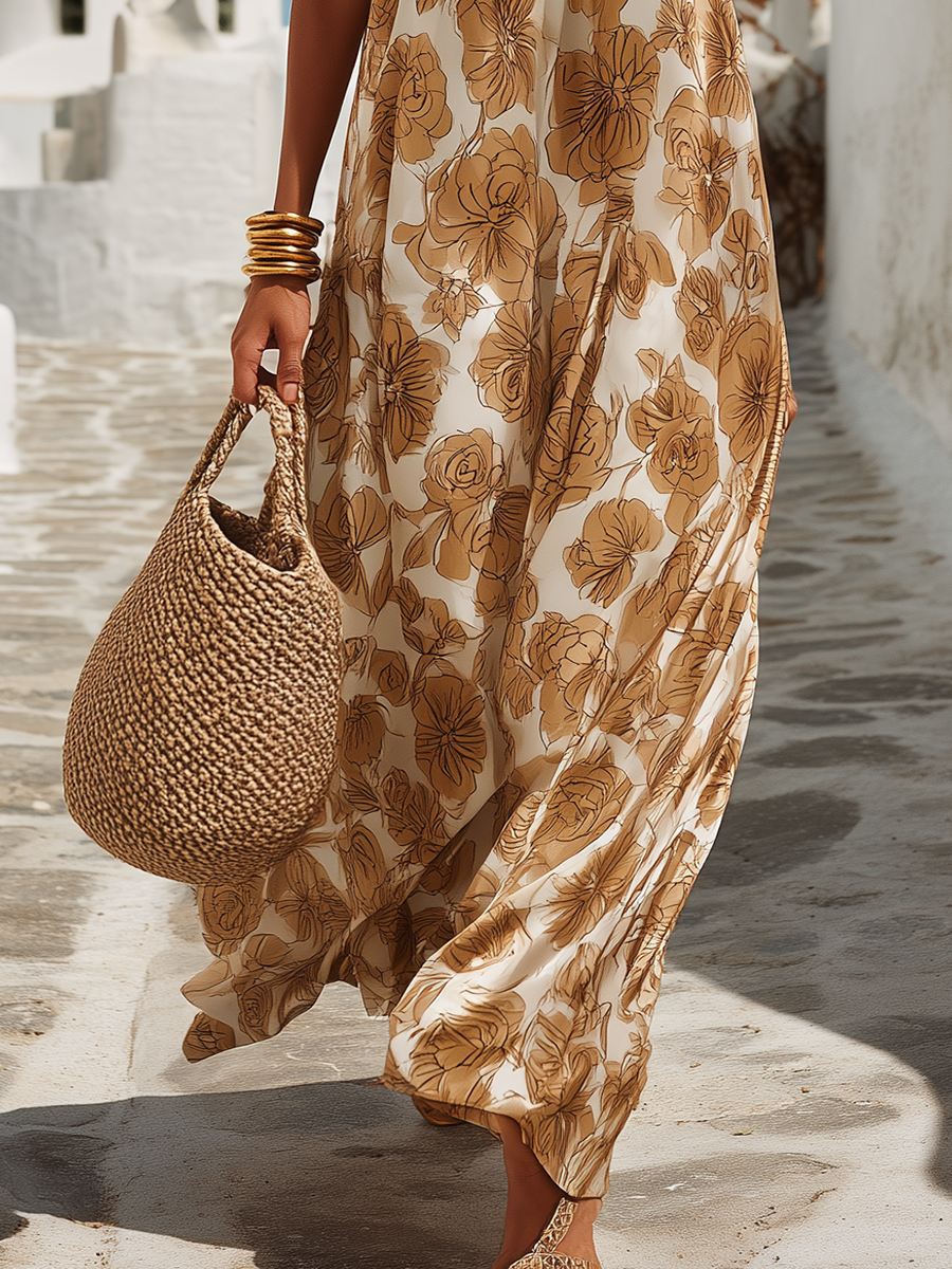Woman in a floral dress holding a woven bag on a stone path.