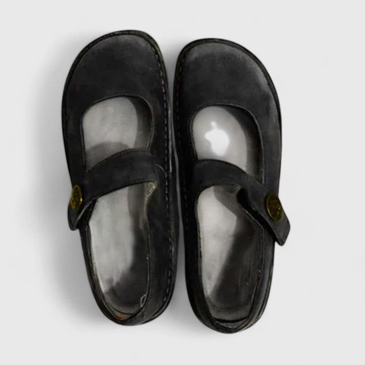 Pair of black sandals on a light gray background