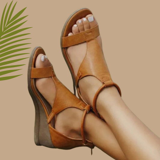 Brown sandals worn with a beige background