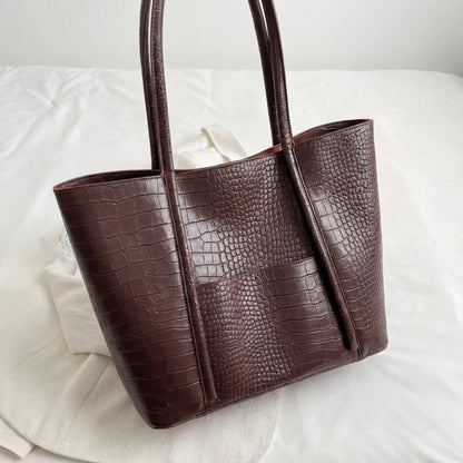 Dark brown textured tote bag on a light background