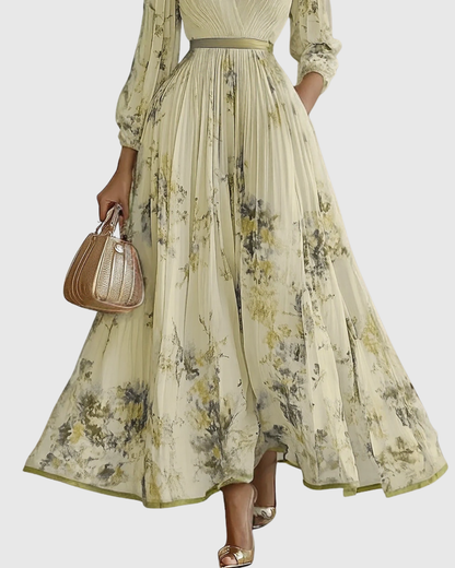 Woman wearing a floral dress holding a handbag on a white background