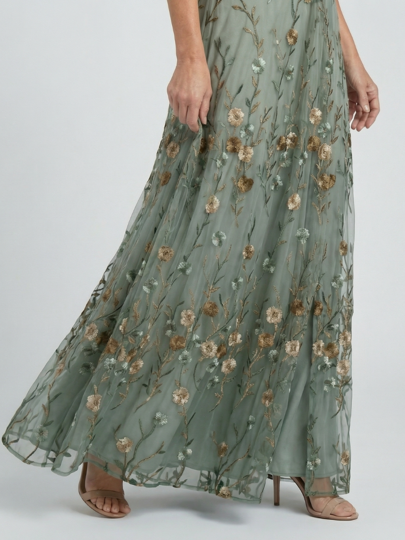 Long floral dress with a subtle pattern on a plain background