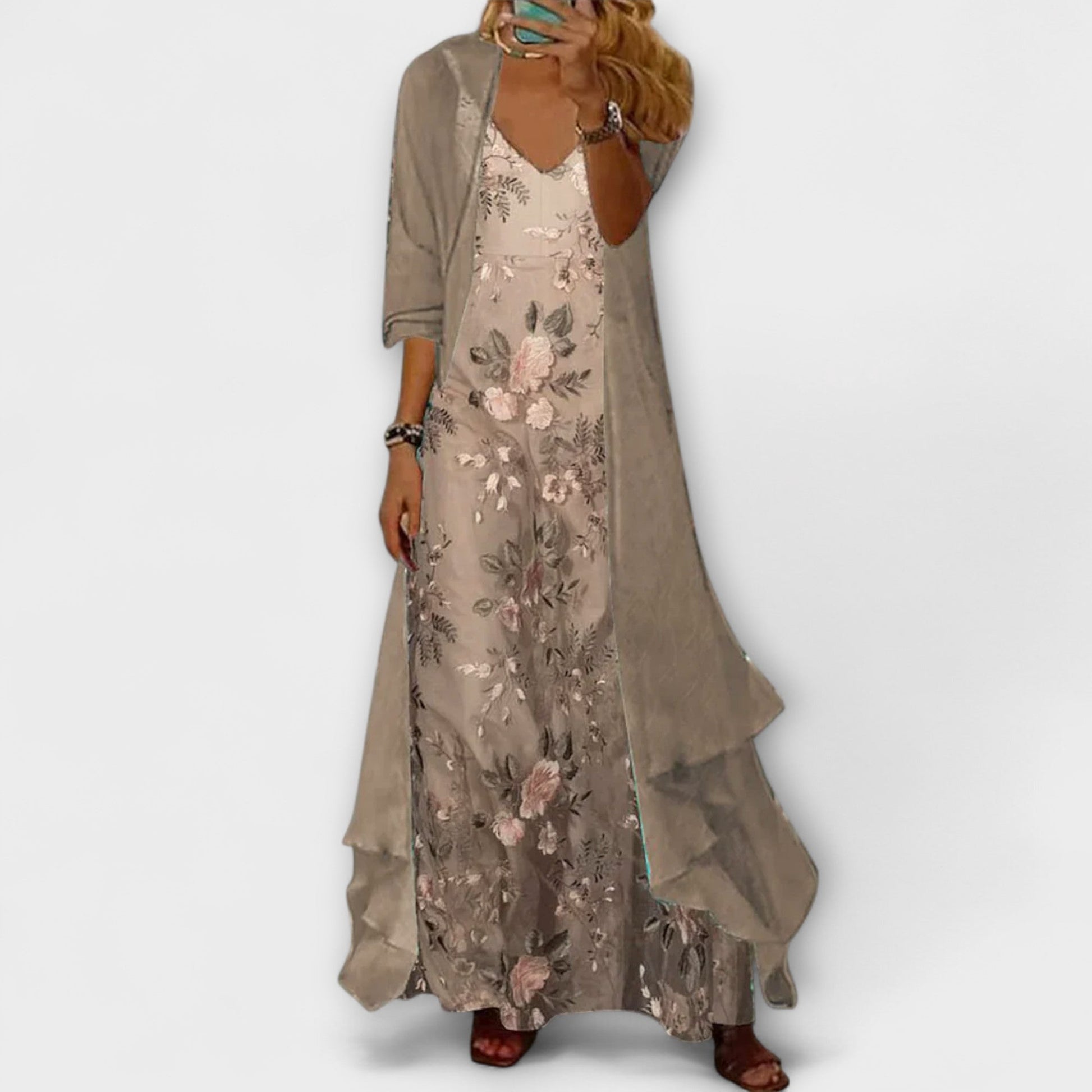 Woman wearing a floral dress with a plain background