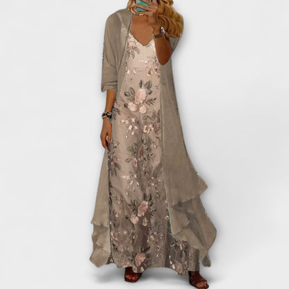 Woman wearing a floral dress with a plain background