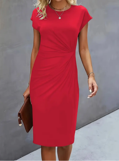 Red dress worn by a person against a gray background