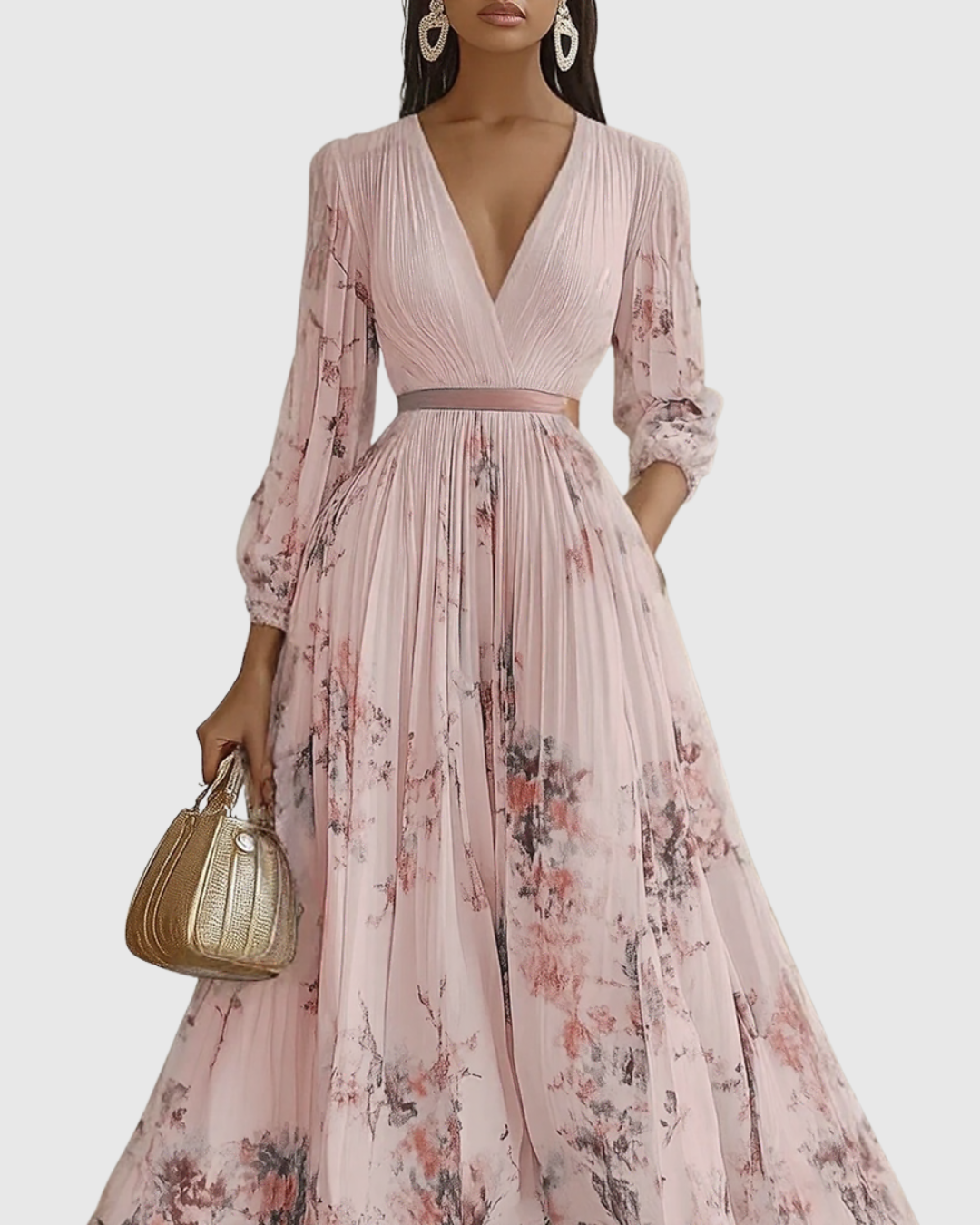 Woman wearing a pink floral dress holding a gold handbag on a white background
