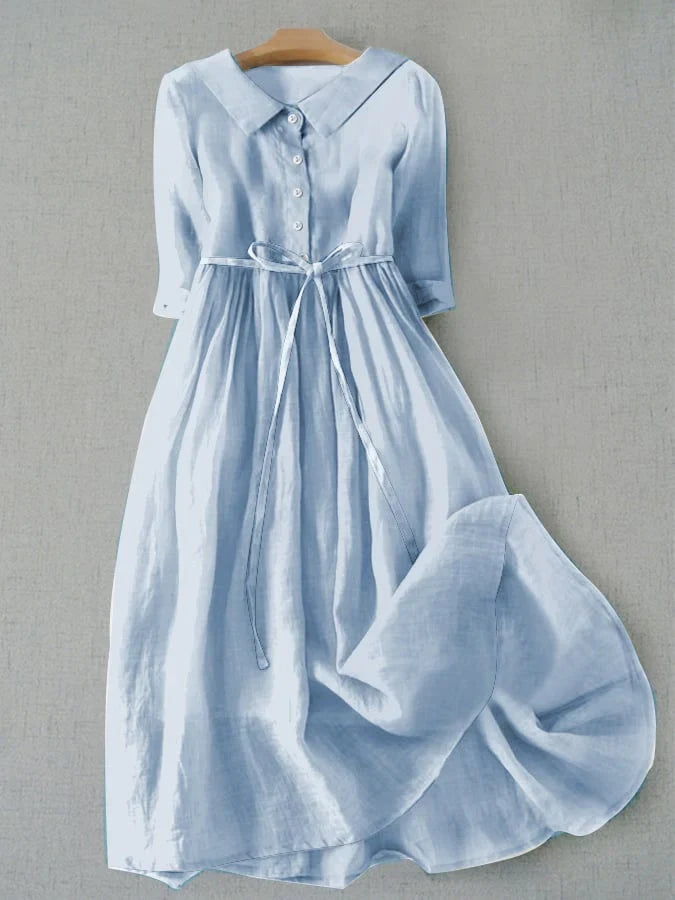 Light blue dress with a collar on a gray background