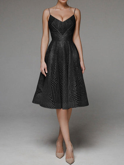 Black beaded dress on a plain background