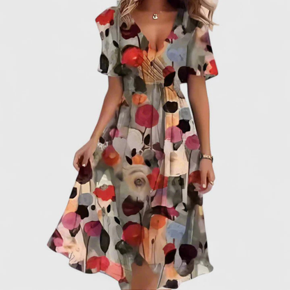 Woman wearing a colorful floral dress on a white background