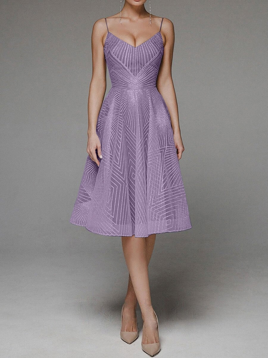Purple dress with geometric pattern on a gray background