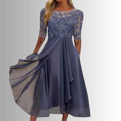 Blue lace dress with long sleeves on a gray background