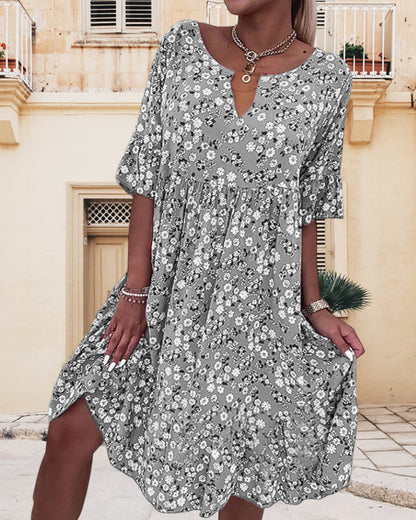 Woman wearing a floral dress in an outdoor setting