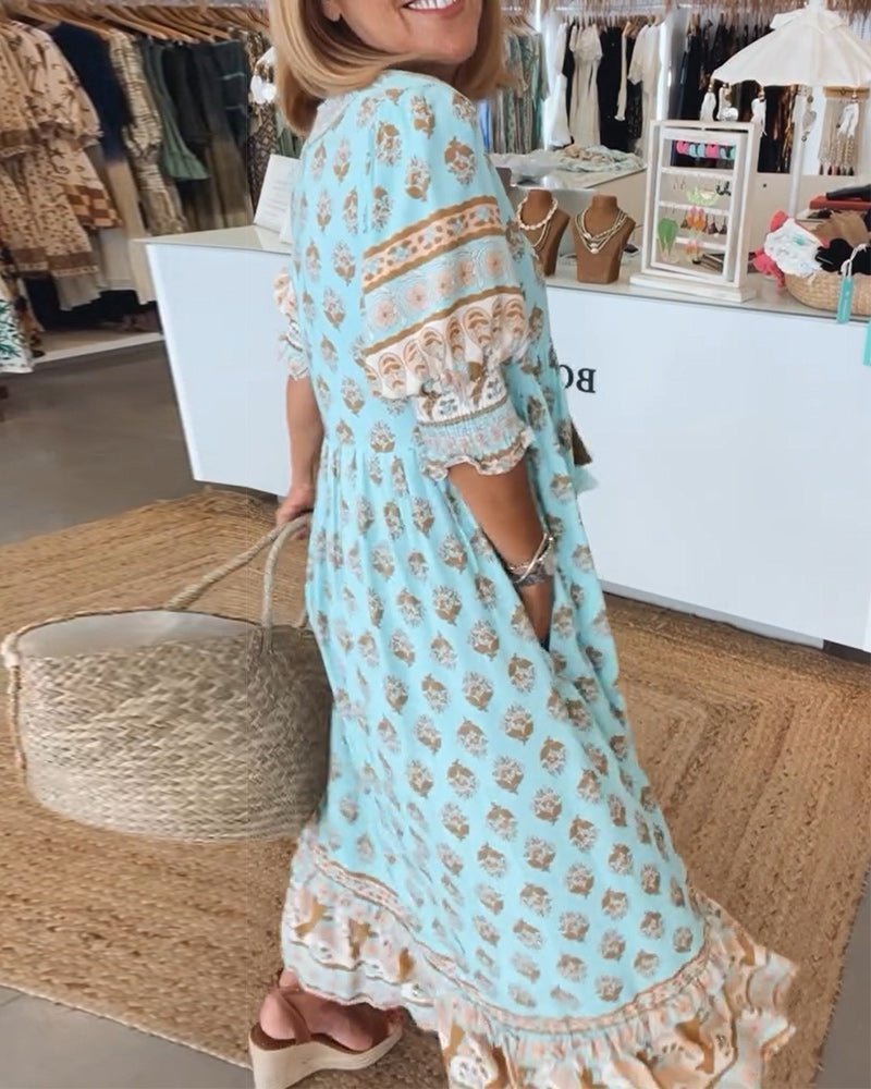 Woman wearing a light blue dress with floral patterns in a store setting