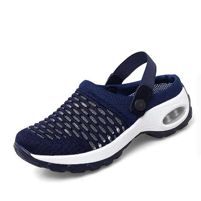 Navy blue and white sneaker on a white background
