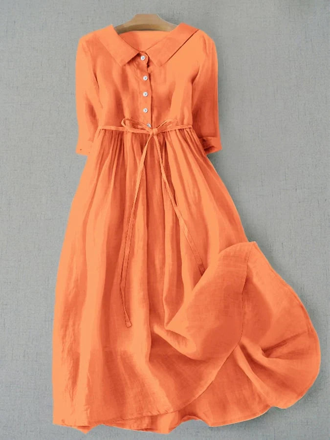 Orange dress on a gray background