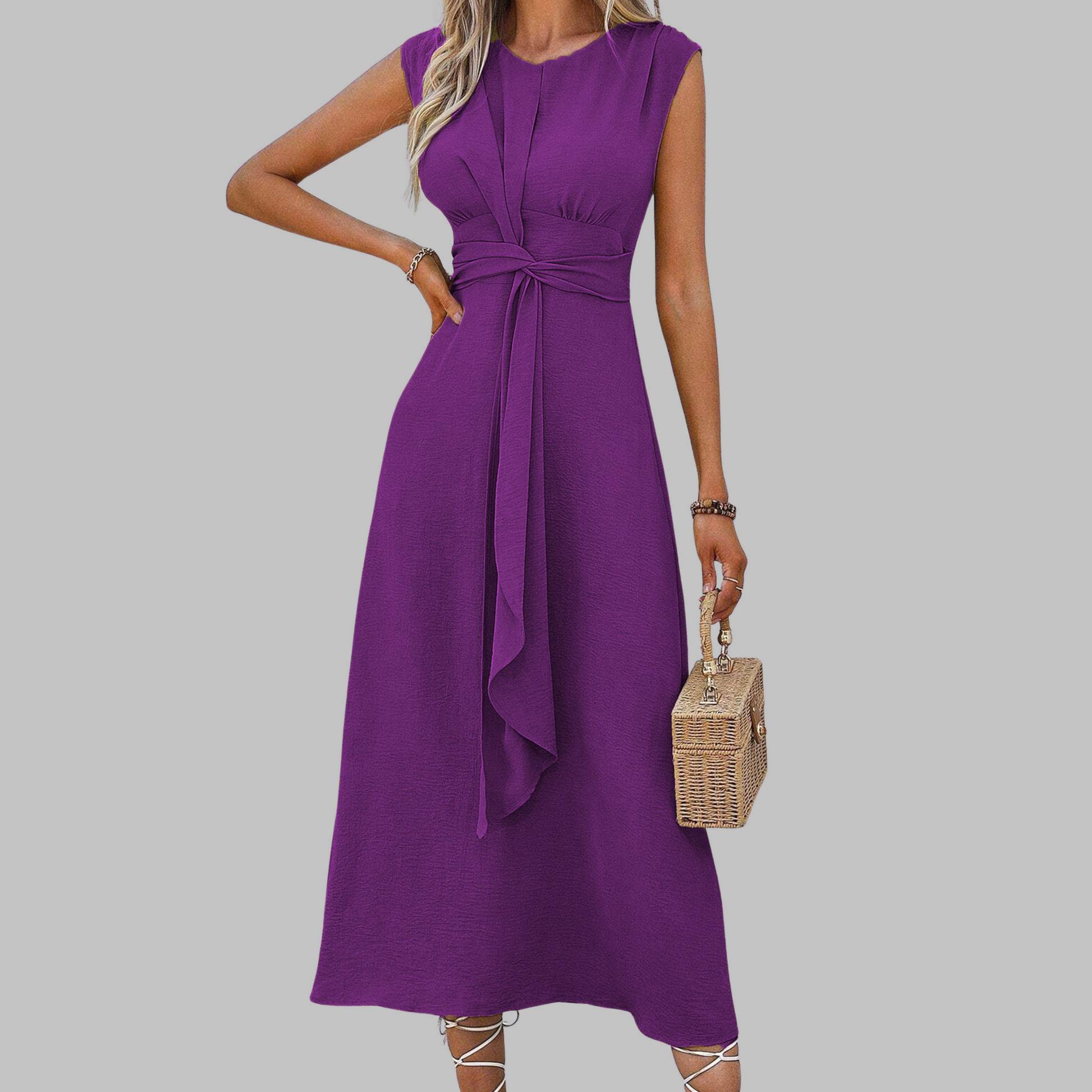 Purple dress worn by a person on a gray background