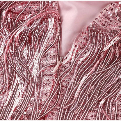 Close-up of a pink sequined fabric with a zipper