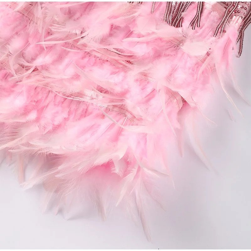 Close-up of pink feathers on a white background