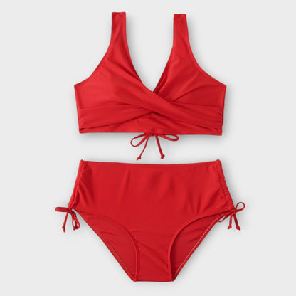 Red bikini set on a light gray background