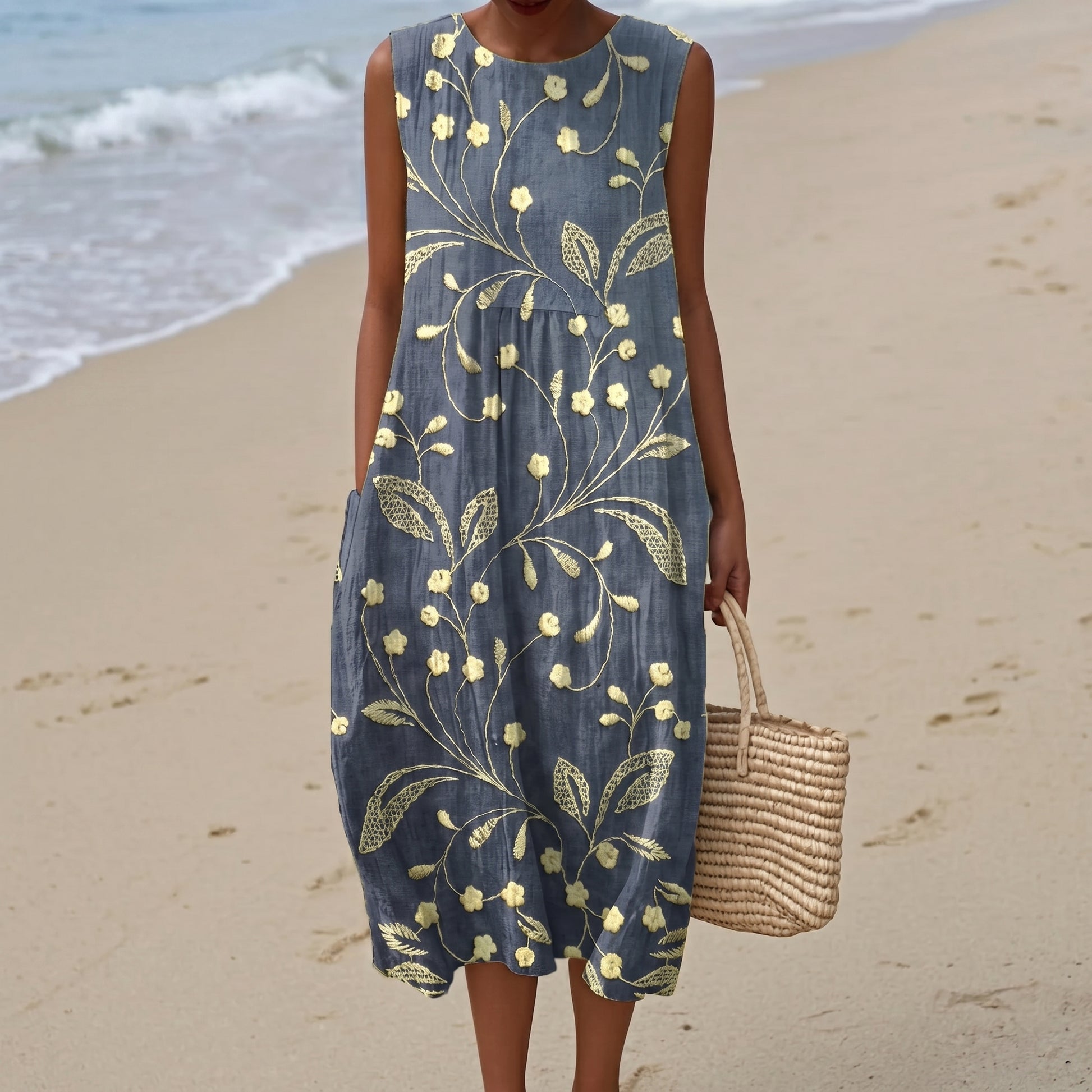 Woman wearing a floral dress on a beach