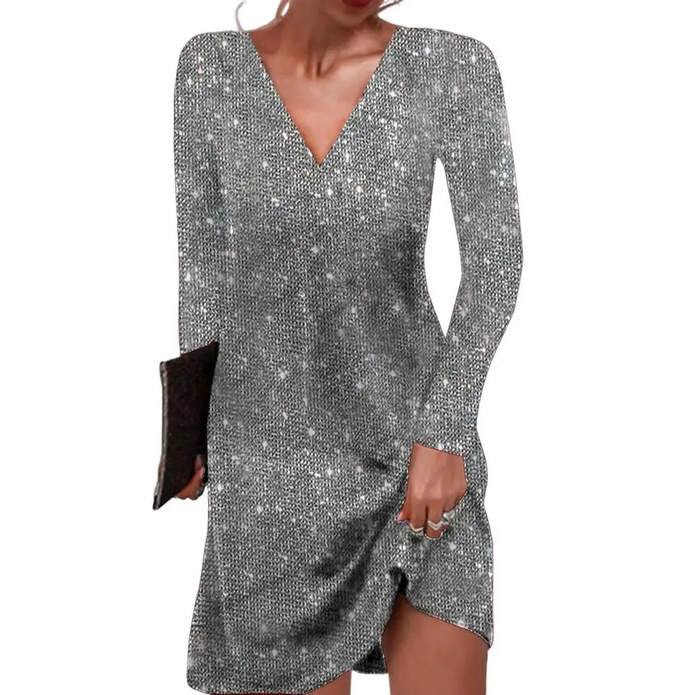 Silver sequin dress worn by a person on a white background