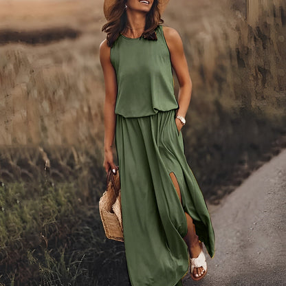 Woman in a green dress walking on a path with a blurred natural background