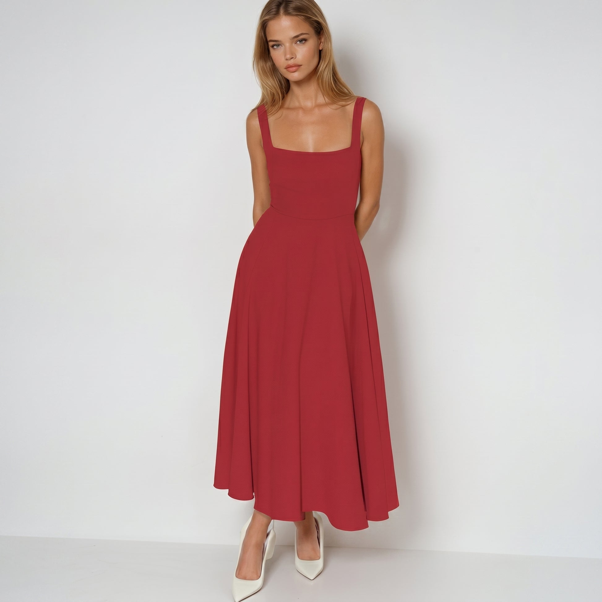 Woman wearing a red dress on a white background