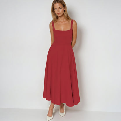 Woman wearing a red dress on a white background