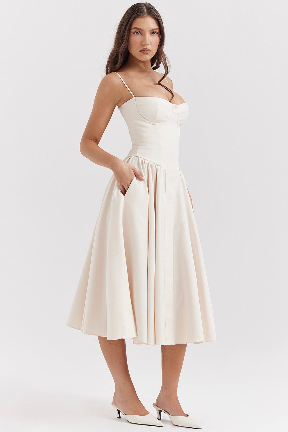 Woman wearing a white dress on a white background
