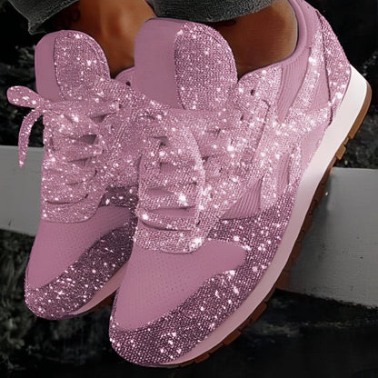 Pink glitter sneakers on a dark background