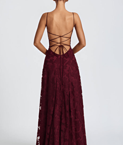 Maroon lace dress with open back on a white background