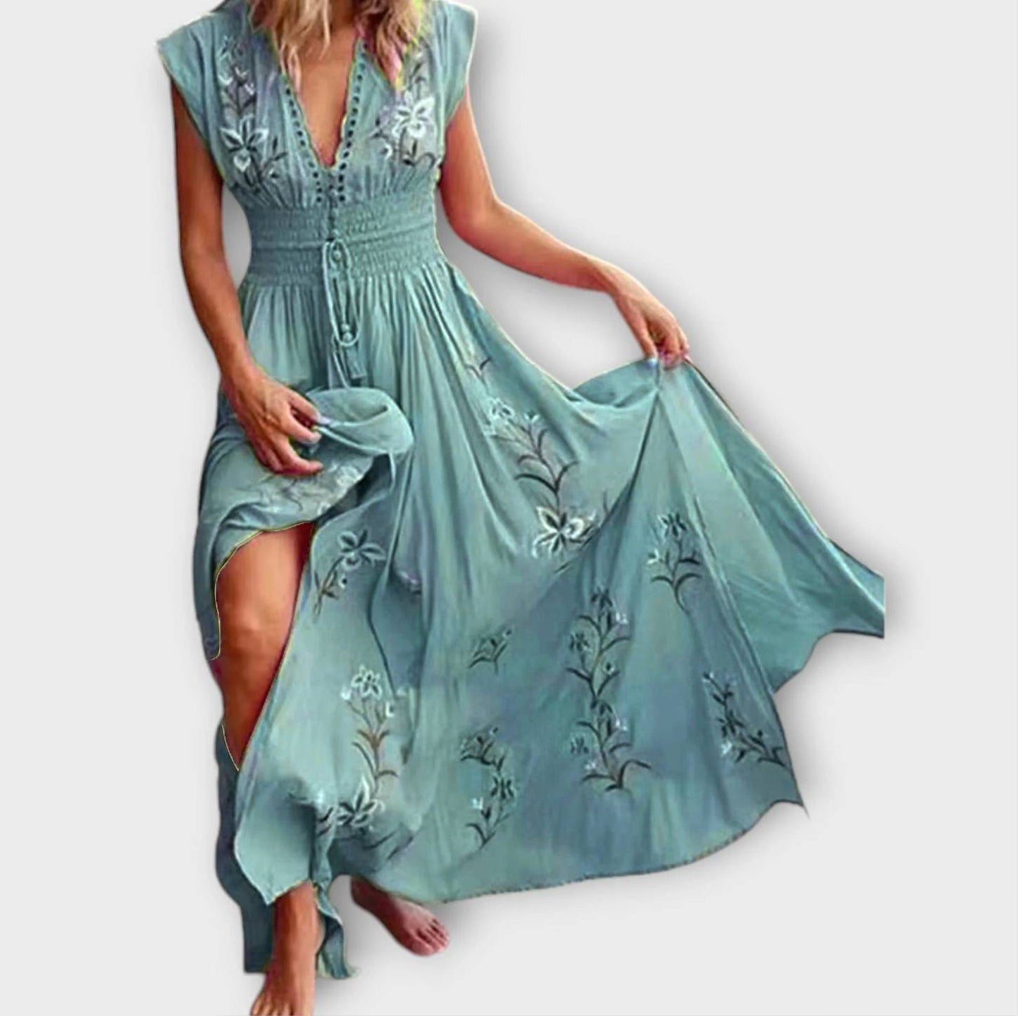 Light blue dress with floral embroidery on a white background