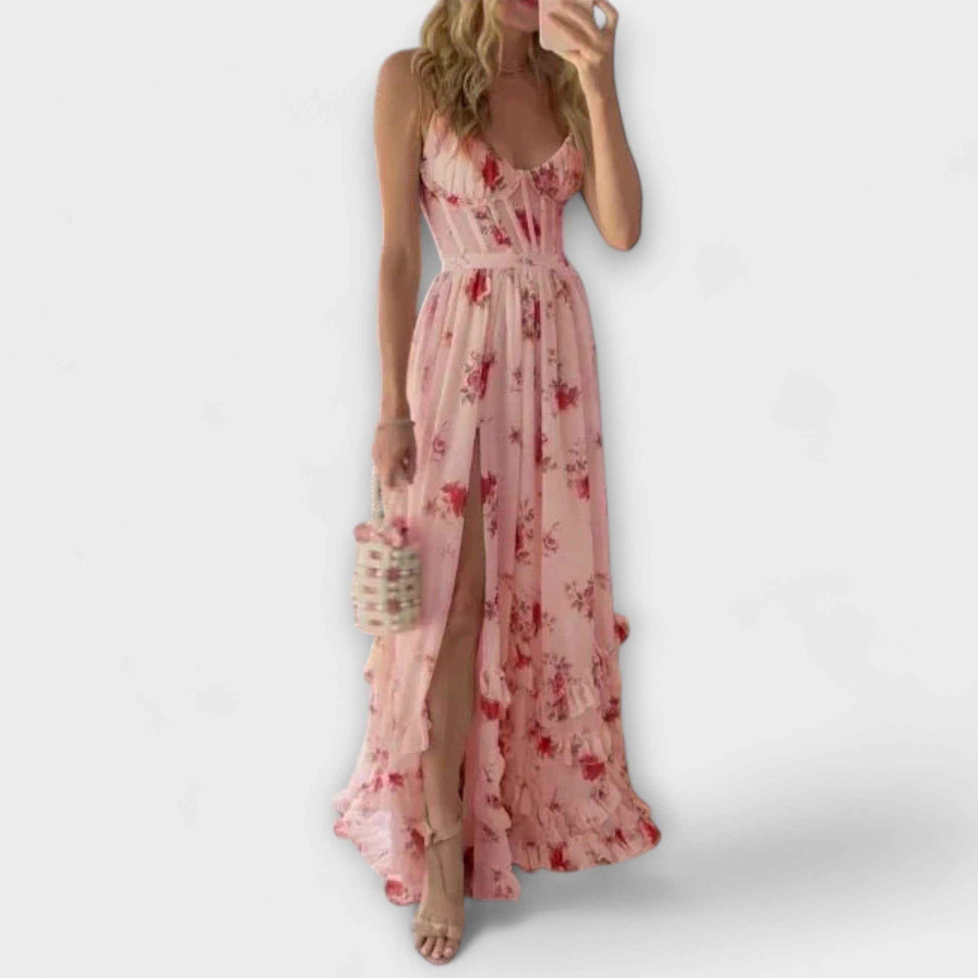 Woman wearing a pink floral dress on a white background