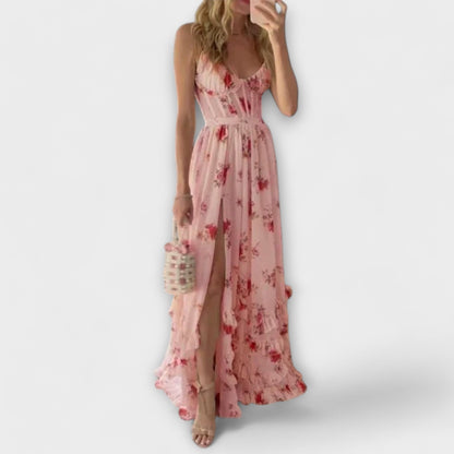 Woman wearing a pink floral dress on a white background