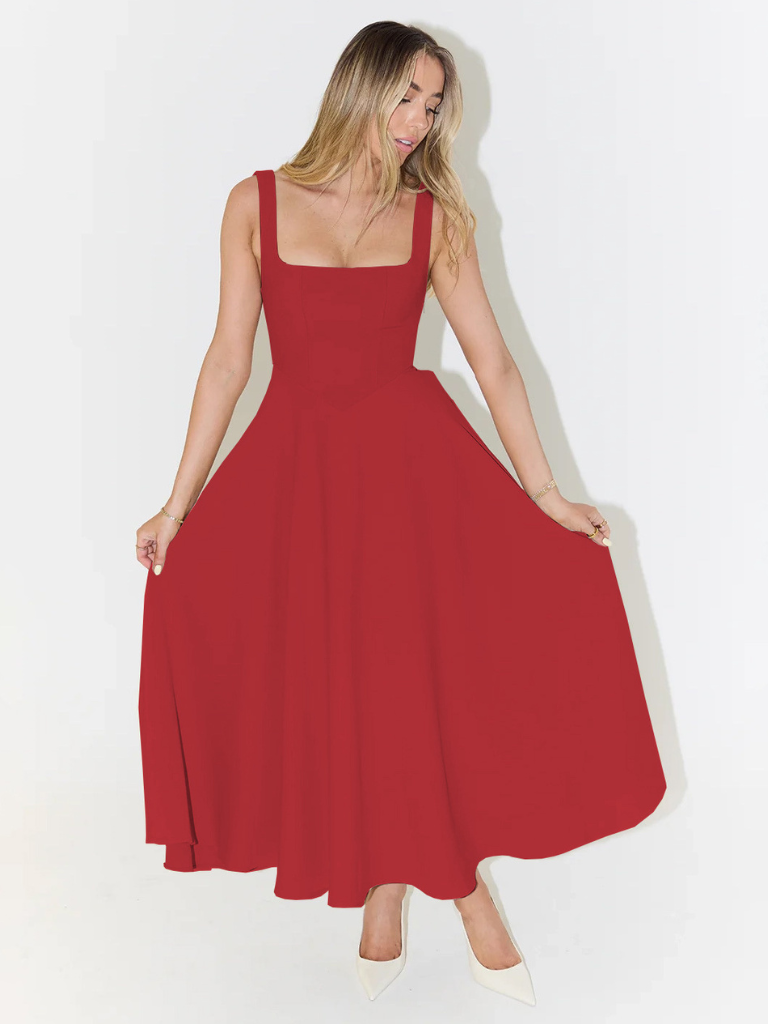 Woman wearing a red dress against a white background