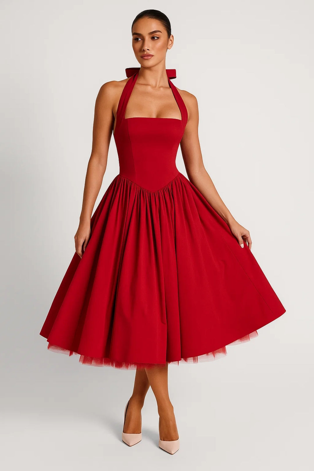 Woman wearing a red dress with a white background