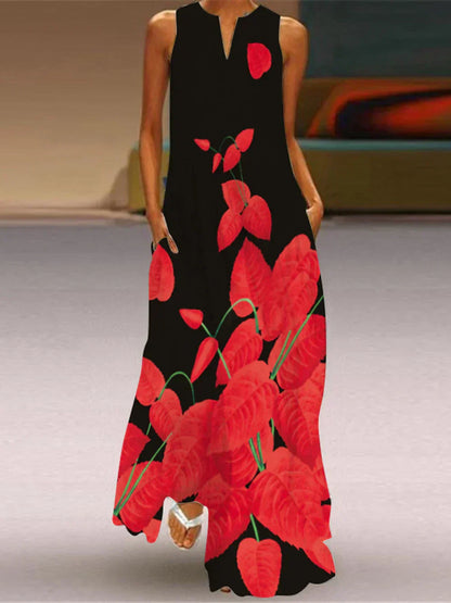 Black dress with red floral pattern worn by a person indoors.