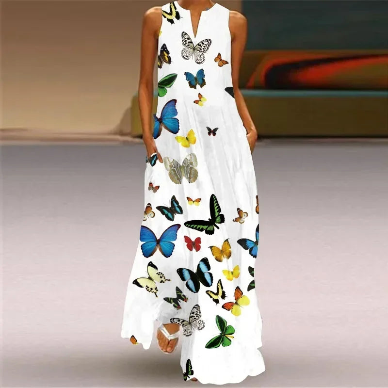 White dress with colorful butterfly pattern worn by a person.