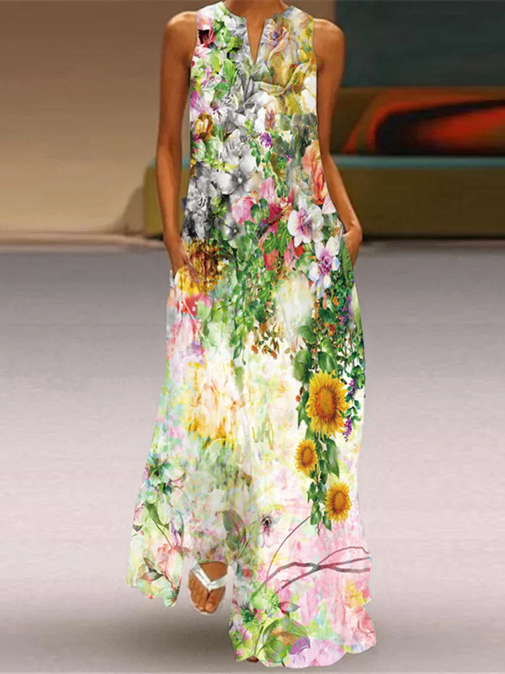Woman wearing a floral dress with a colorful pattern on a neutral background