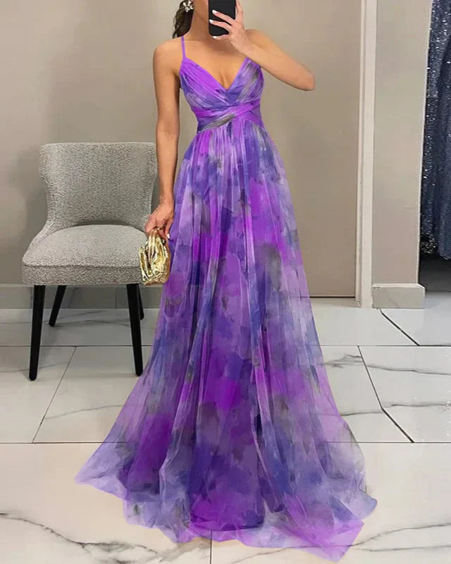 Purple floral evening gown worn by a person, with a chair and tiled floor in the background.