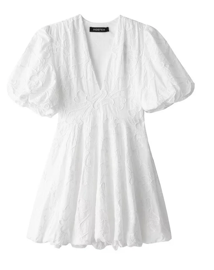 White blouse with puff sleeves on a white background