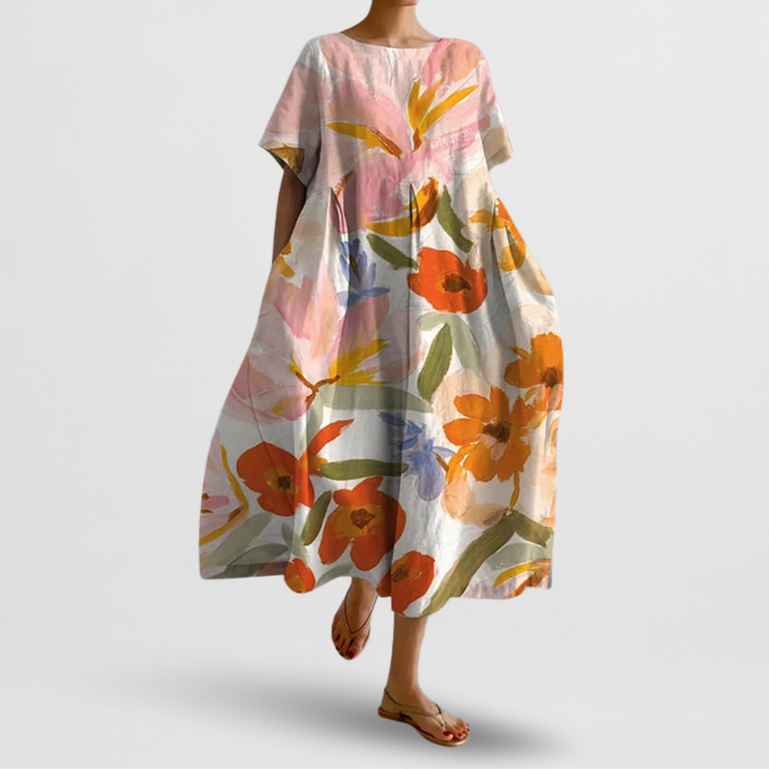 Floral dress with orange and pink flowers on a plain background