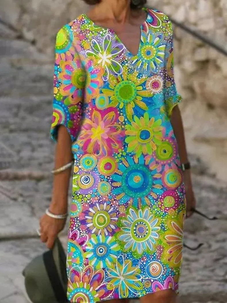 Colorful floral dress with a pattern of flowers on a blurred background
