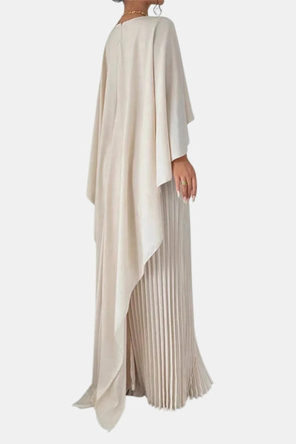 Beige dress with a draped top and pleated skirt on a white background