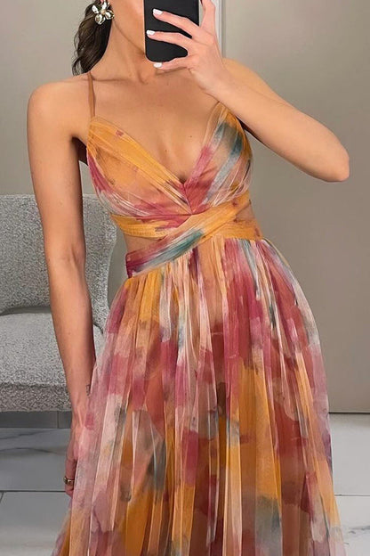 Woman wearing a colorful dress taking a mirror selfie.