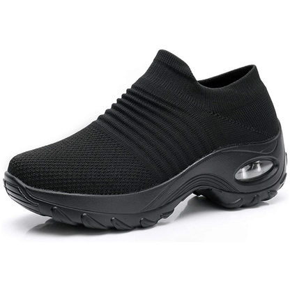 Black slip-on sneaker with a thick sole on a white background