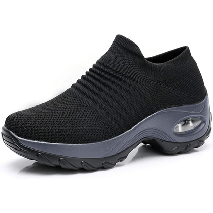 Black slip-on sneaker with a gray sole on a white background