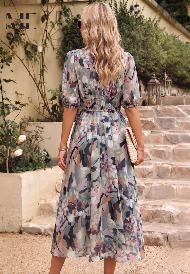 Woman in a floral dress walking outdoors on stone steps.