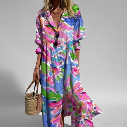 Woman wearing a colorful floral dress with a gray background
